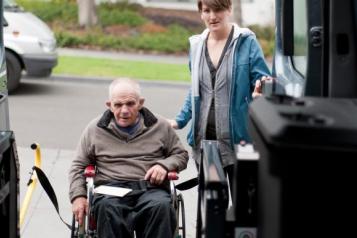 Wheelchair user using an adapted vehicle